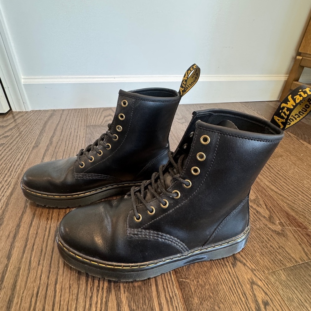 Dr. Martens Black Combat Boots with High Top Design and Durable Rubber Sole